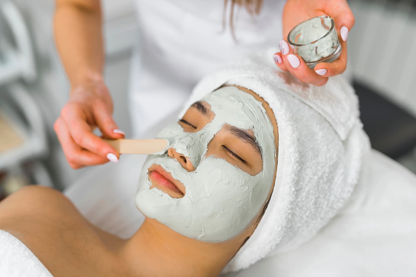 Aesthetic facial mud mask treatment at Luxe